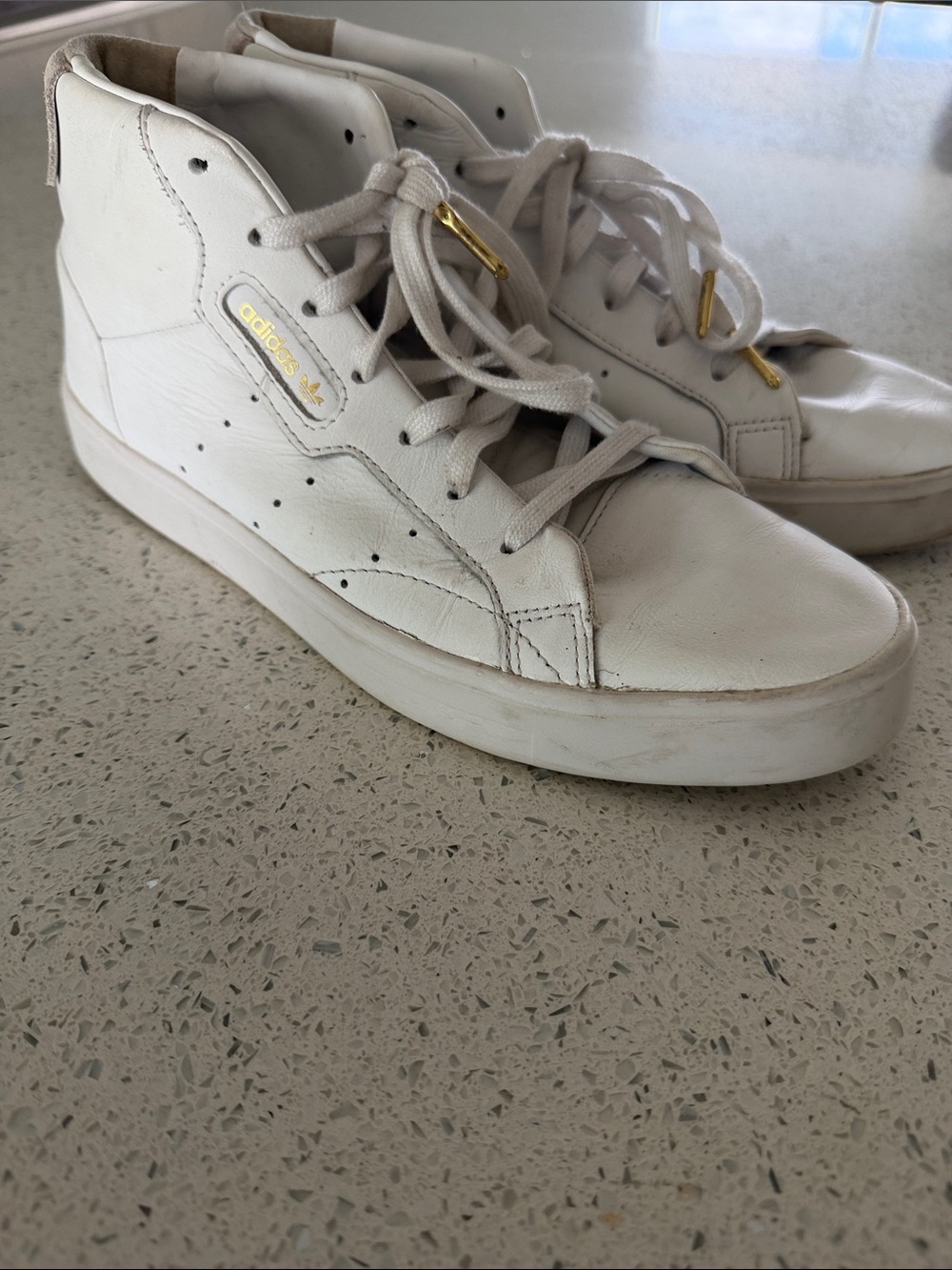 Adidas White High-Top Sneakers with Gold Accents